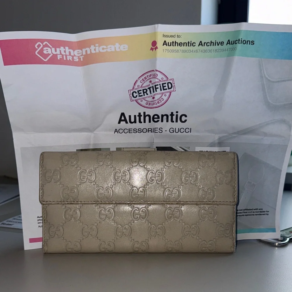 Authentic Gucci included COA certification Gold Embossed wallet